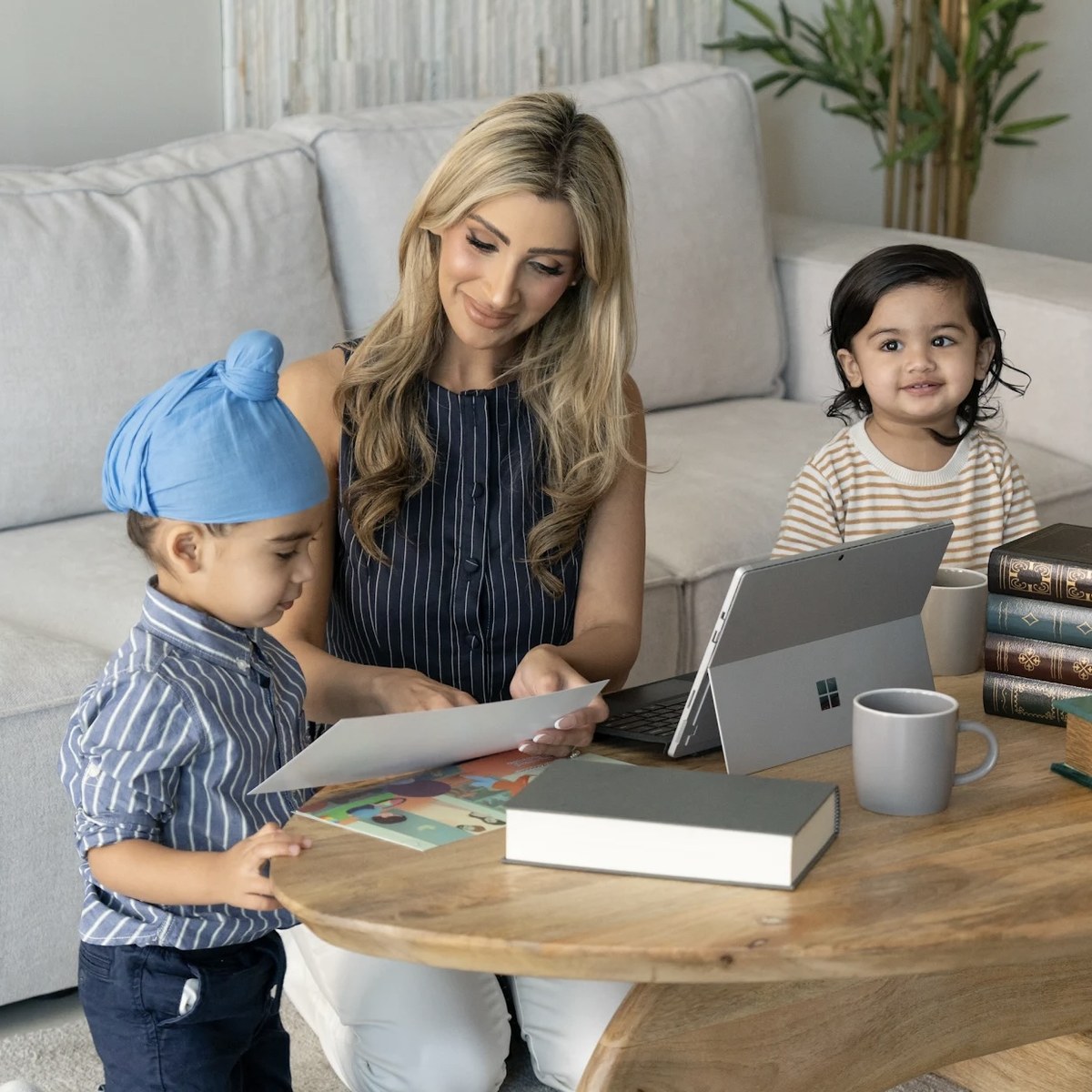 Author Harpreet Bahia reading with her two sons at home